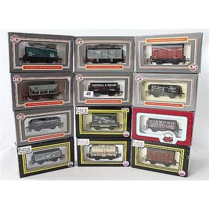 Twelve various Dapol freight carriages, including 'Benzol…
