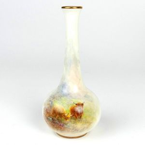 A small Royal Worcester bottle vase, hand painted with Highland…
