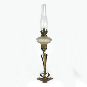 An Arts & Crafts brass kerosene lamp, in the manner of W.A.…