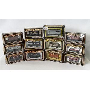 Eleven Mainline freight carriage models, and one other Dapol…