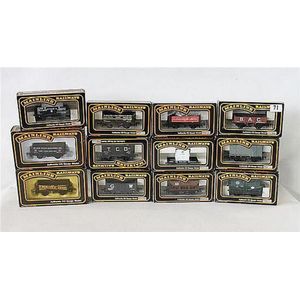 Twelve various Mainline freight carriage models, boxed (12).