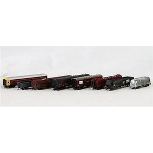 Eight various passenger and freight carriages, including…
