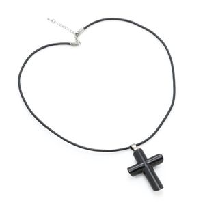 A horn cruciform pendant necklace, size 38 x 59 mm, on leather&hellip;