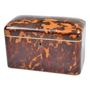 A Victorian tortoiseshell veneered tea caddy. rectangular with…