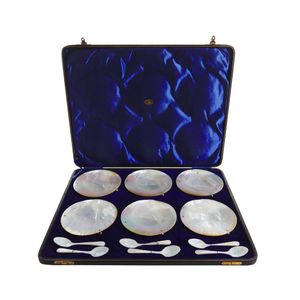 A handsome cased set of Scottish pearl shell caviar bowls and…