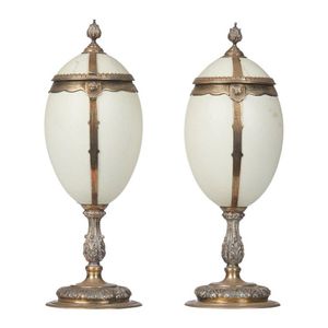 A pair of Edwardian sterling silver mounted ostrich eggs, each…