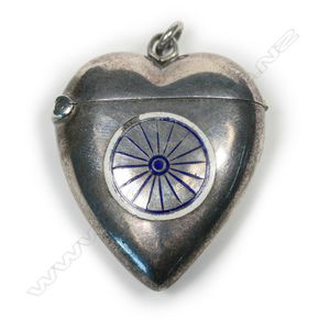 A late Victorian silver heart form and enamel vesta, the front…