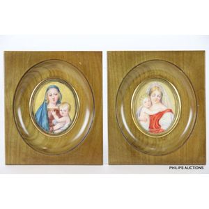A pair of Madonna and Child miniatures, oval paintings in the…
