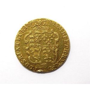 An English gold half Guinea, George III, 1785, on the obverse…