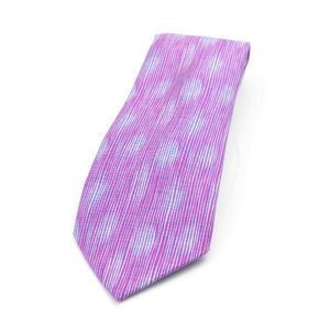 A silk tie by Hermes, styled in a reeded design in purple and&hellip;