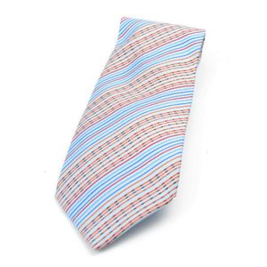 A silk tie by Hermes, styled with with orange, red and navy&hellip;