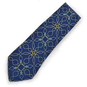 A silk tie by Hermes, styled with buckles and rope on a blue&hellip;