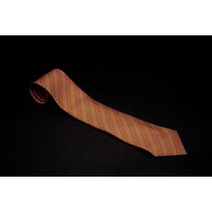 A silk tie by Hermes, styled with repeated motif on orange&hellip;