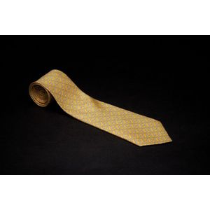 A silk tie by Hermes, styled with repeated 'H' motif on yellow&hellip;