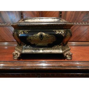 A Chinoiserie lacquered tea caddy of sarcophagus form, early…