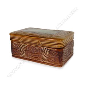 A Crown Lynn Wharetana ware trinket box, mask decoration, brown…