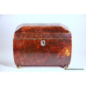 An early Victorian tortoiseshell tea caddy, circa 1830s/40s, of…