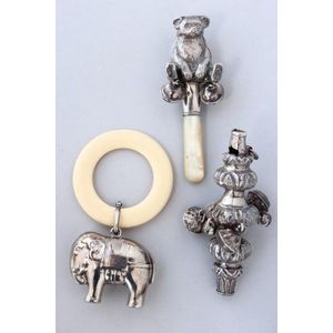 Three English sterling silver child's Rattles, comprising of…