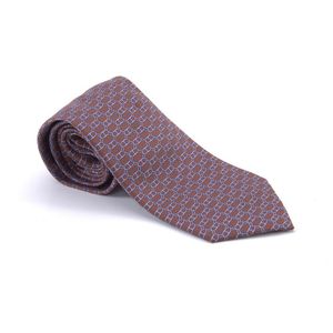 A silk tie by Hermes, styled with a mauve chain pattern on&hellip;