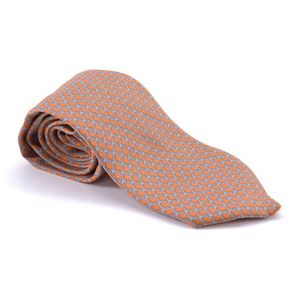 A silk tie by Hermes, styled with grey interlinked 'H' design&hellip;