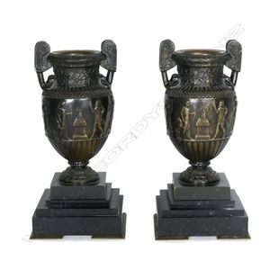 A pair of 19th century Roman style bronze urns on marble bases,…