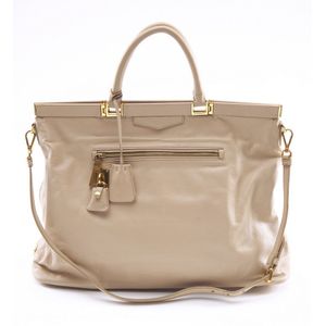A handbag by Prada, styled in beige leather with gold metal… - Handbags ...