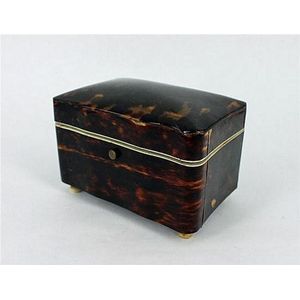 A Victorian tortoiseshell tea caddy, serpentine sides, shallow…