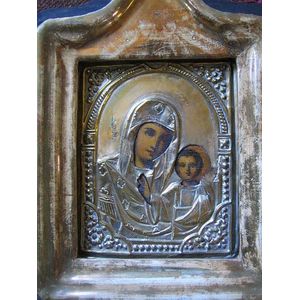 A 19th century Russian icon depicting the mother of God; brass…