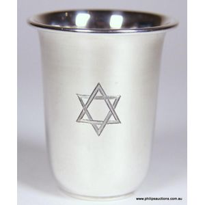 A sterling silver kiddush cup, the tapering beaker with a…