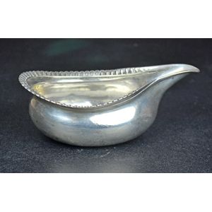 A Georgian sterling silver medical pourer having a beaded edge,…