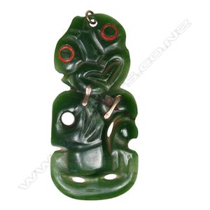 A 19th century pounamu Maori hei tiki with gold repairs, with…