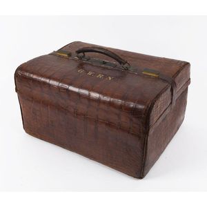 A crocodile skin doctor's bag with gilt monogram 'G.W.R.N.',…