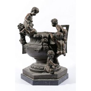 Classical style bronze urn decorated with five clambering putti,…
