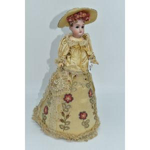 Antique porcelain head pin-cushion doll dressed in hand…
