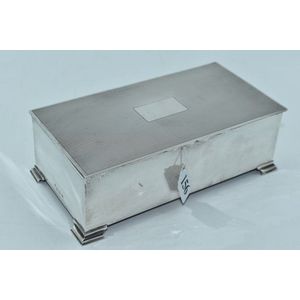 Sterling silver cigarette box with wooden lining raised on four…