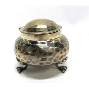 A sterling silver ink well stand with a beaten pattern, Arthur…