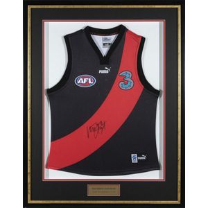 A Matthew Lloyd signed Essendon jumper, framed and glazed
