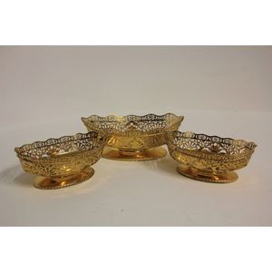 An Edwardian silver gilt three piece table centrepiece…