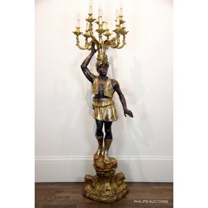 A polychrome and giltwood blackamoor floor lamp, early 20th…