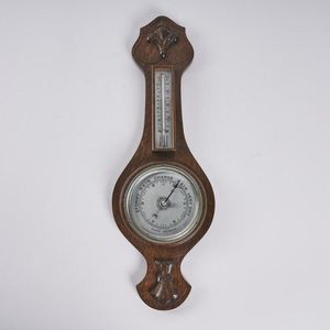 A vintage oak cased barometer, made in England, height 58 cm,…