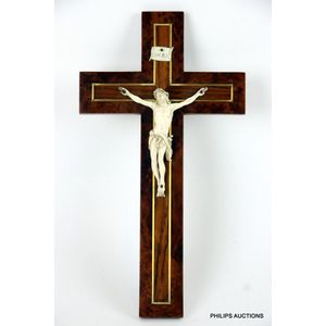 An antique European ivory and walnut crucifix, 19th century,…