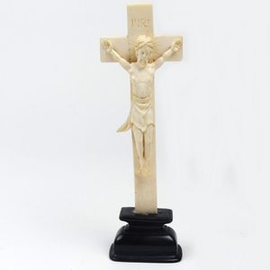 An antique ivory crucifix, raised on rosewood plinth base,…