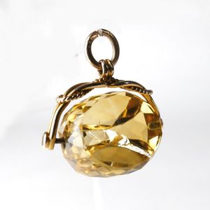 A Victorian 9ct. yellow gold and citrine fob spinner, the…
