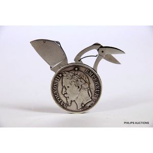 An 1867 French silver five Franc coin manicure set, a Napoleon…