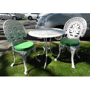 An outdoor white painted metal circular table & match pair of…