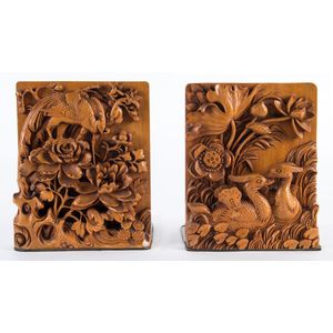 A pair of Chinese carved timber and brass bookends, early to…