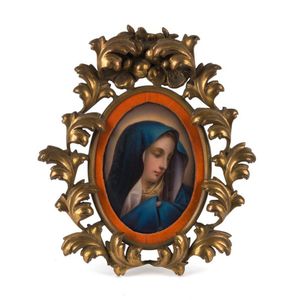 A miniature Mary Madonna painting on porcelain in carved gilt…