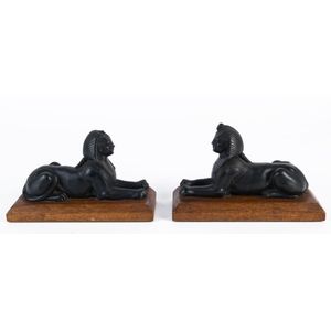 A pair of spelter sphinx bookends on wooden bases, early 20th…