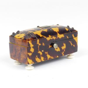 A small 19th century tortoiseshell trunk form trinket box, the…