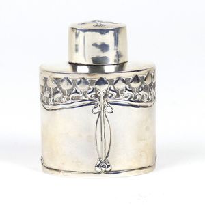 An Art Nouveau silver small tea caddy, oval section, decorated…